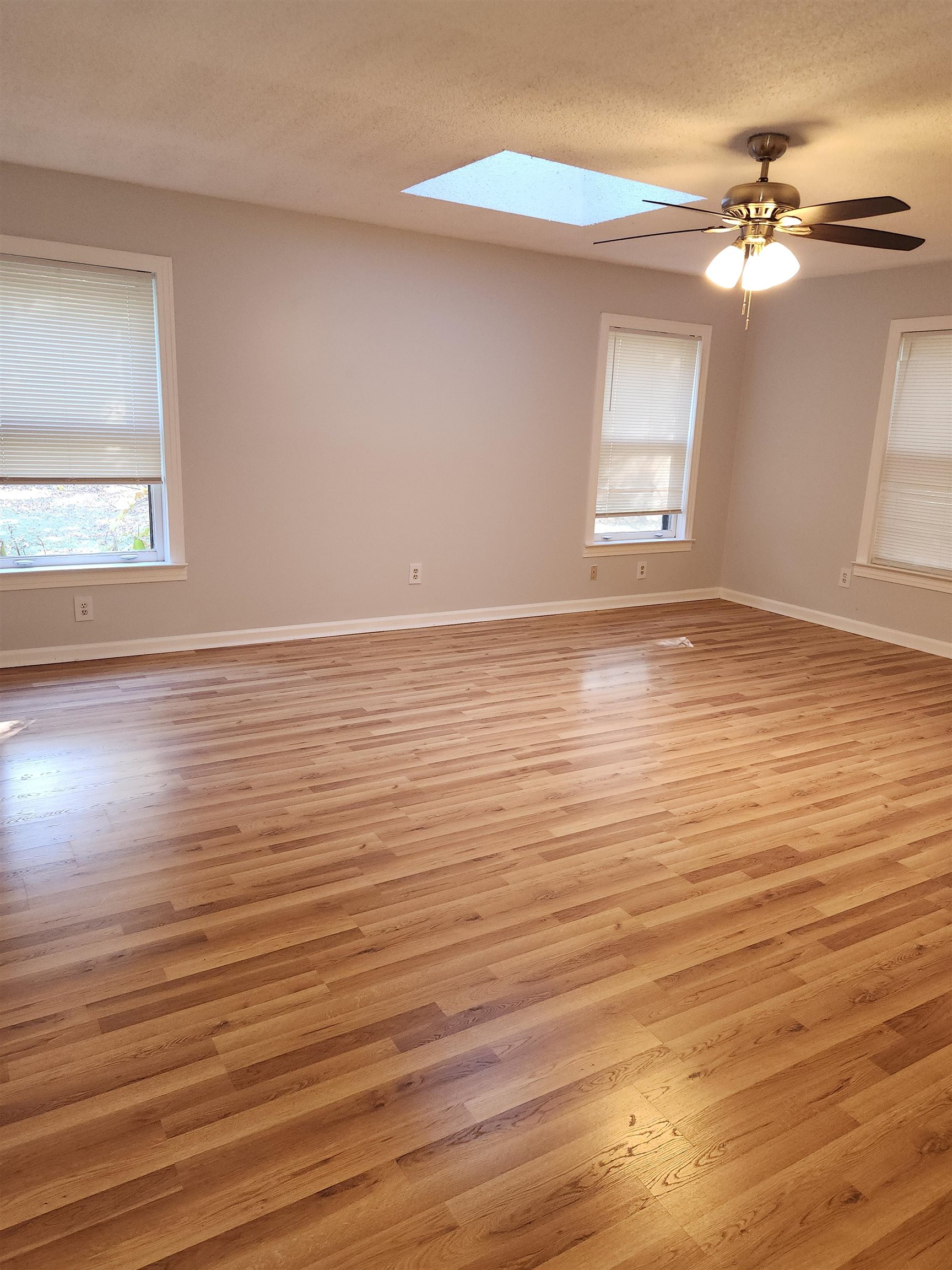 7188 Pleasant Ridge Road Arlington, TN 38002 - Photo 17 of 28 a view of an empty room with wooden floor and a window