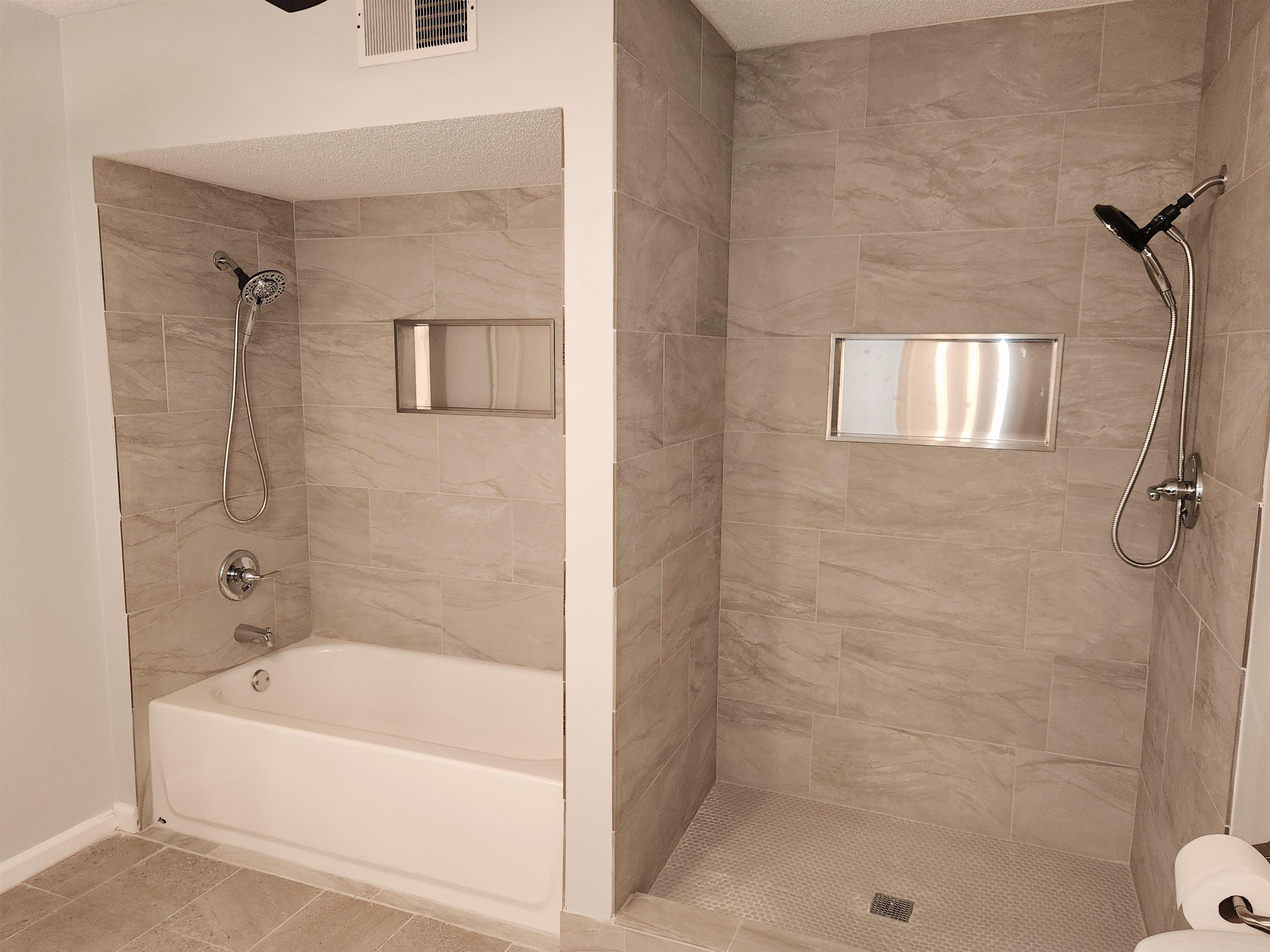 7188 Pleasant Ridge Road Arlington, TN 38002 - Photo 19 of 28 a bathroom with a bathtub and shower