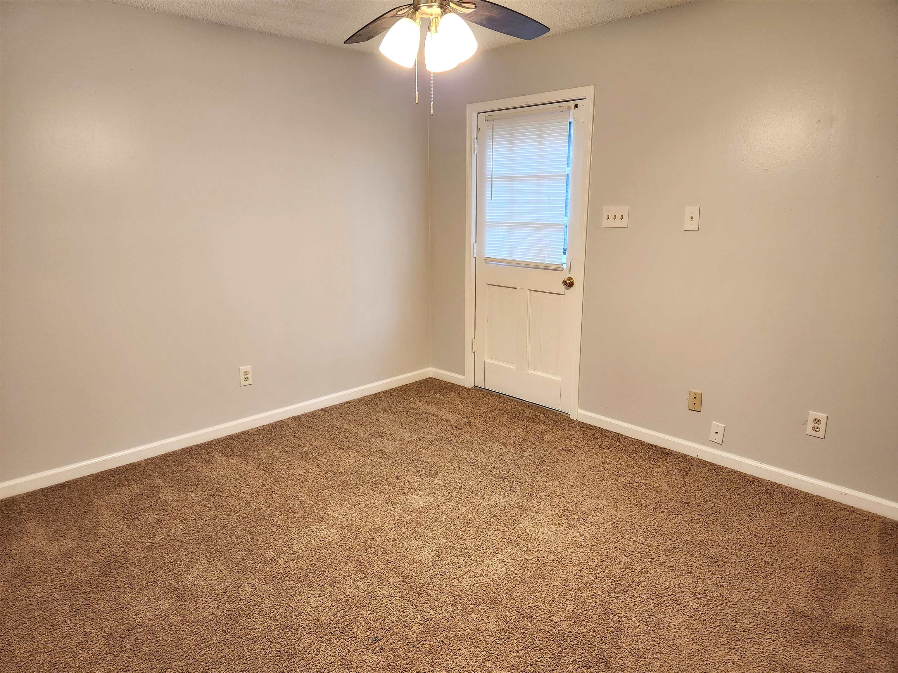 7188 Pleasant Ridge Road Arlington, TN 38002 - Photo 23 of 28 an empty room with a chandelier fan