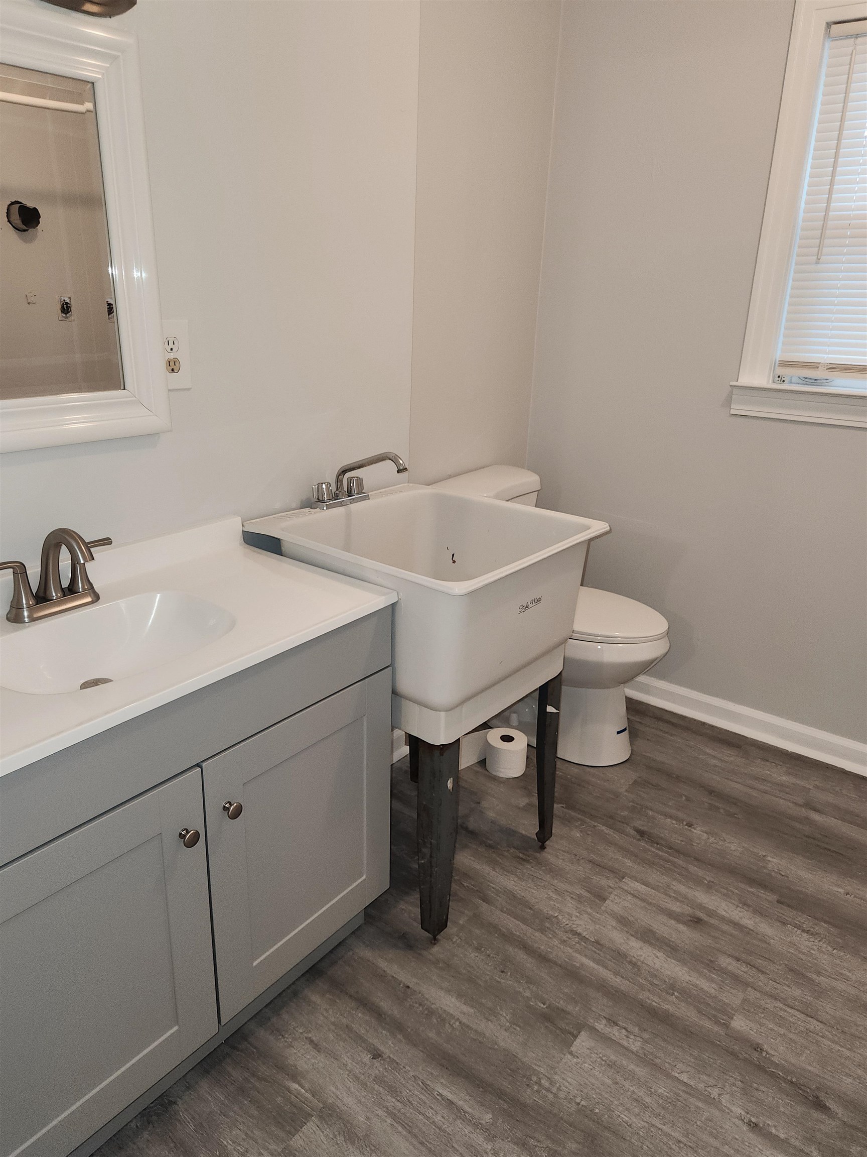 7188 Pleasant Ridge Road Arlington, TN 38002 - Photo 24 of 28 a bathroom with a sink and a toilet
