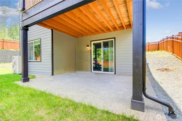 a view of yard with swimming pool and green space