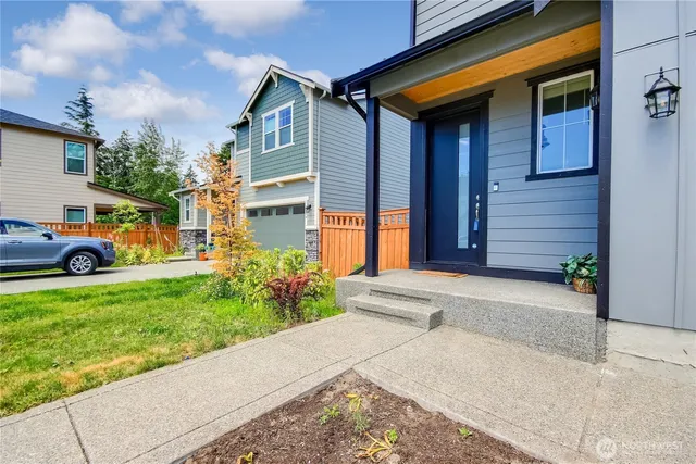a front view of a house with garden