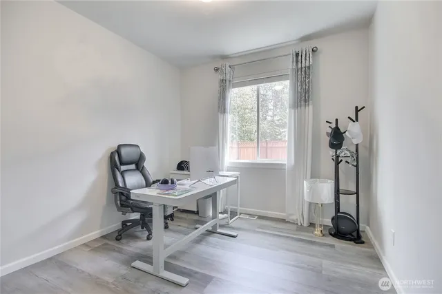 a workspace with furniture and a window