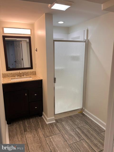 1583 Doxbury Road Towson, MD 21286 - Photo 27 of 31 a view of an empty room with wooden floor and cabinet