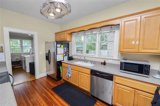a kitchen with stainless steel appliances granite countertop a stove and a sink