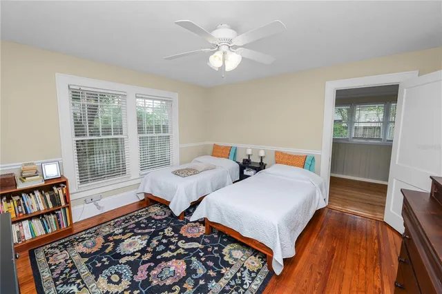 a living room with furniture and a book shelf