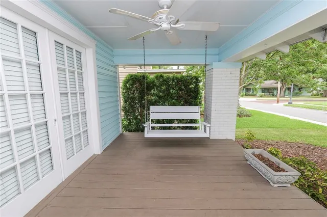a view of backyard with hardwood and balcony