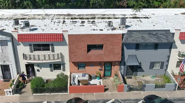 a patio with table and chairs