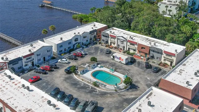 an aerial view of a house with outdoor space