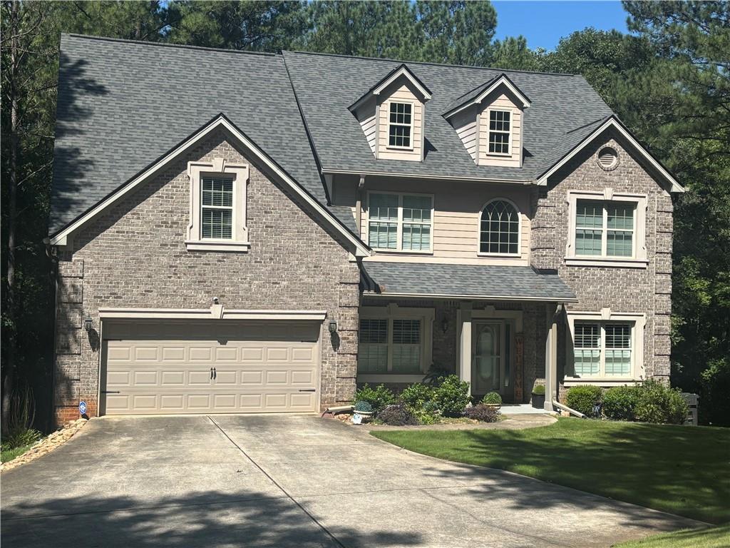 a view of house with yard