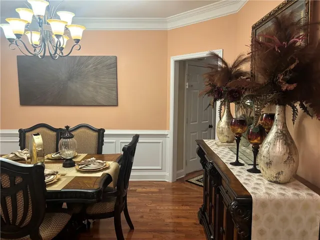 a view of a dining room with furniture and wooden floor