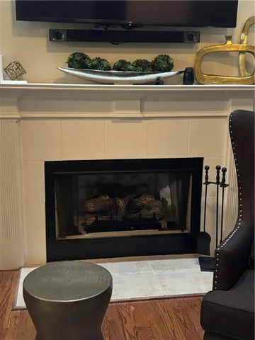 a living room with furniture and a book shelf