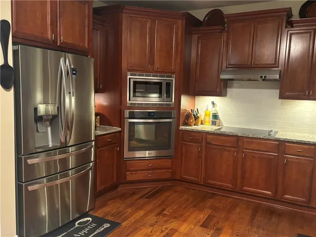a view of a entryway door with wooden floor