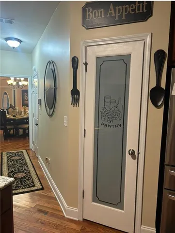 a view of a kitchen counter space and wooden floor