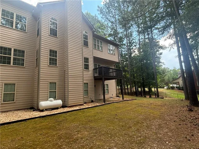 a backyard of a house with lots of green space