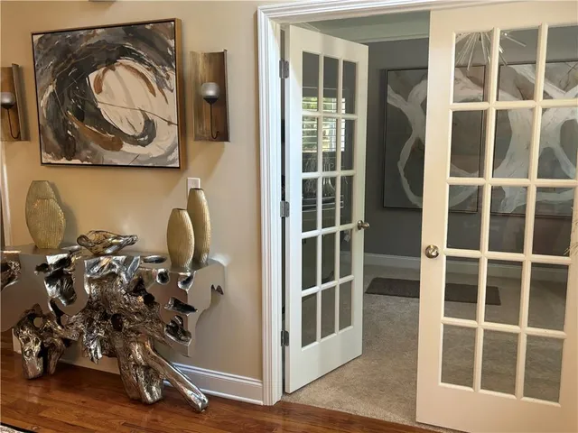 a view of a entryway with wooden floor and windows