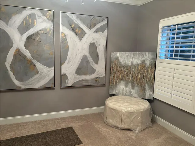 a bathroom with a toilet and a window