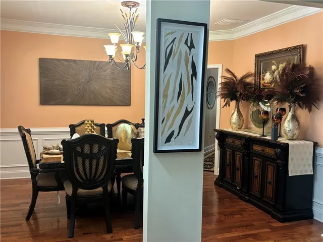 a view of a dining room with furniture and window