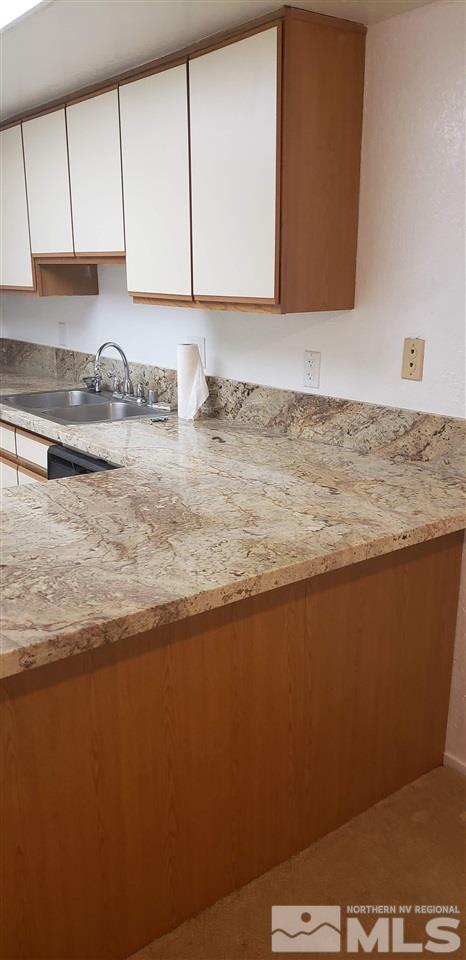 2300 Dickerson Road, Unit 65 Reno, NV 89503 - Photo 7 of 9 a view of kitchen with granite countertop cabinets