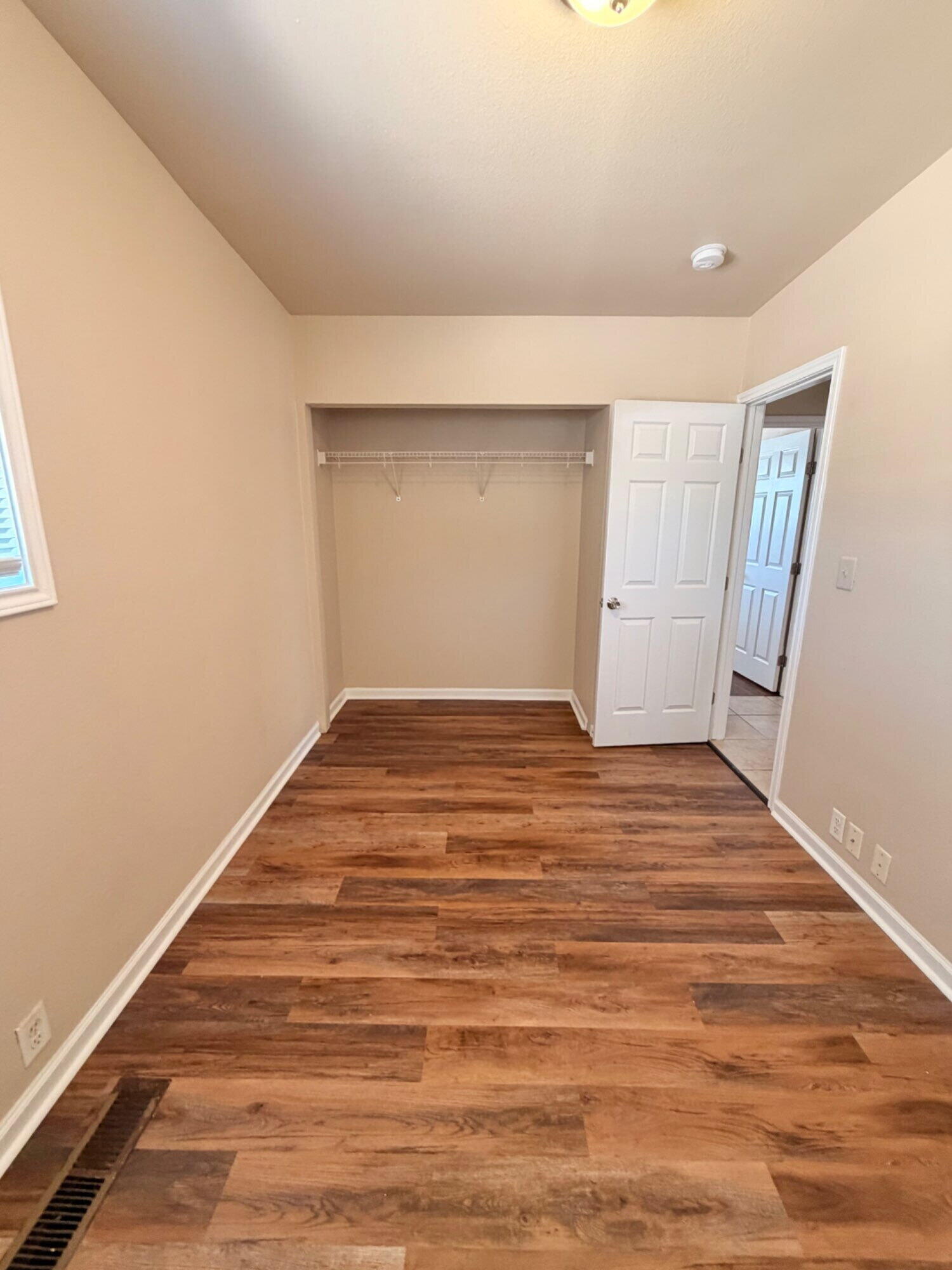2301 49th Street Lubbock, TX 79412 - Photo 13 of 18 a view of empty room with wooden floor