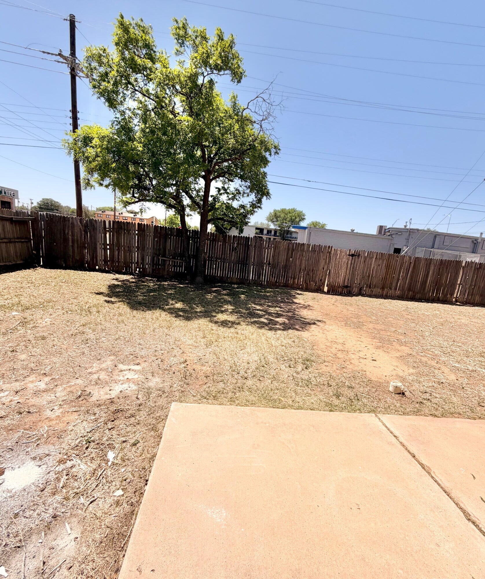 2301 49th Street Lubbock, TX 79412 - Photo 17 of 18 a view of a backyard of the house