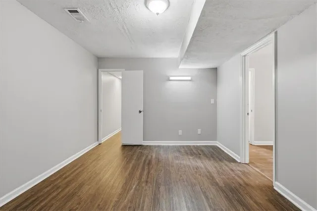 a view of room with hardwood floor