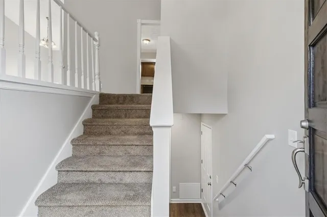 a view of entryway with wooden floor and stairs