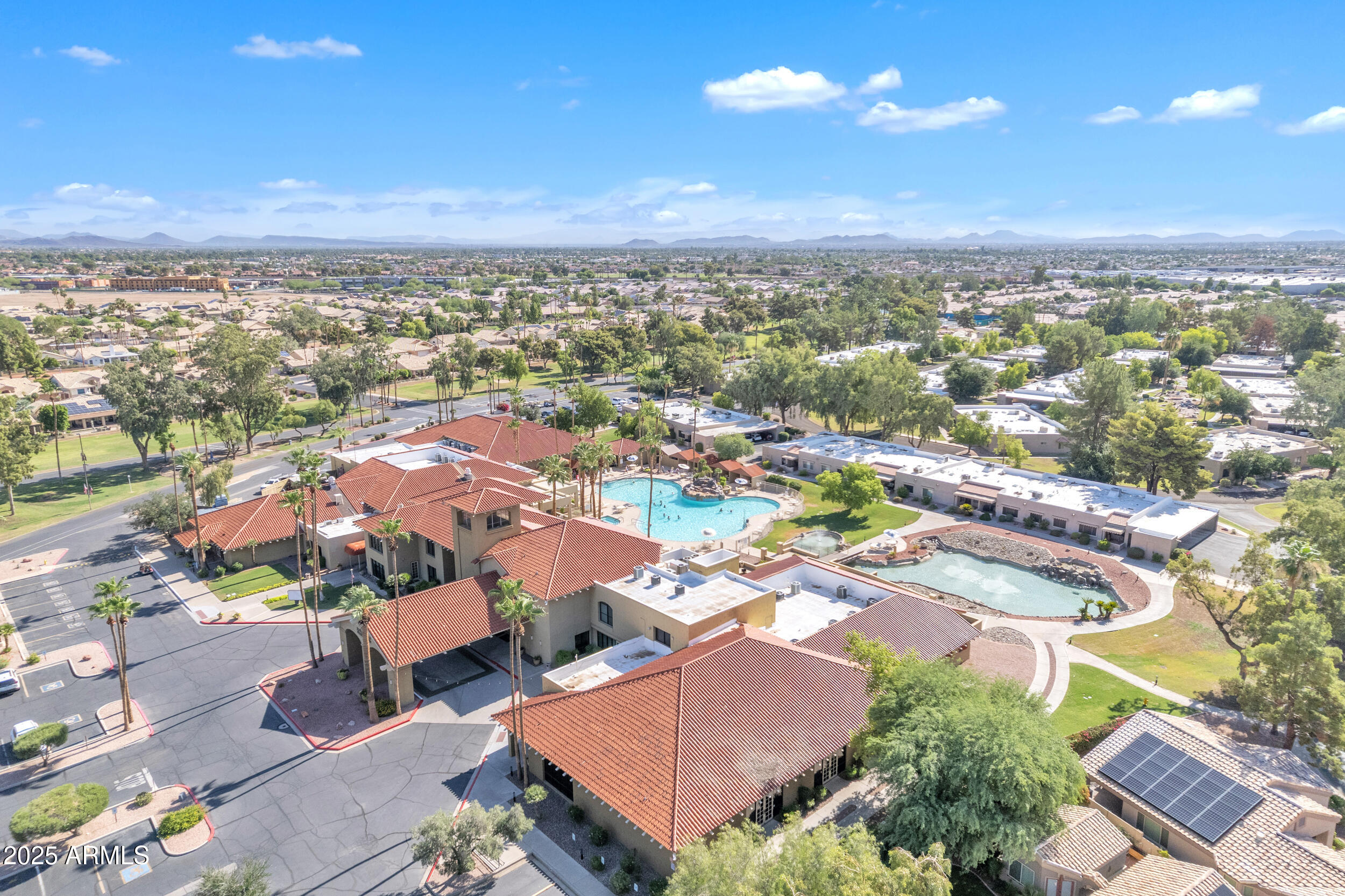 14300 West Bell Road, Unit 105 Surprise, AZ 85374 - Photo 38 of 45 an aerial view of residential houses with outdoor space