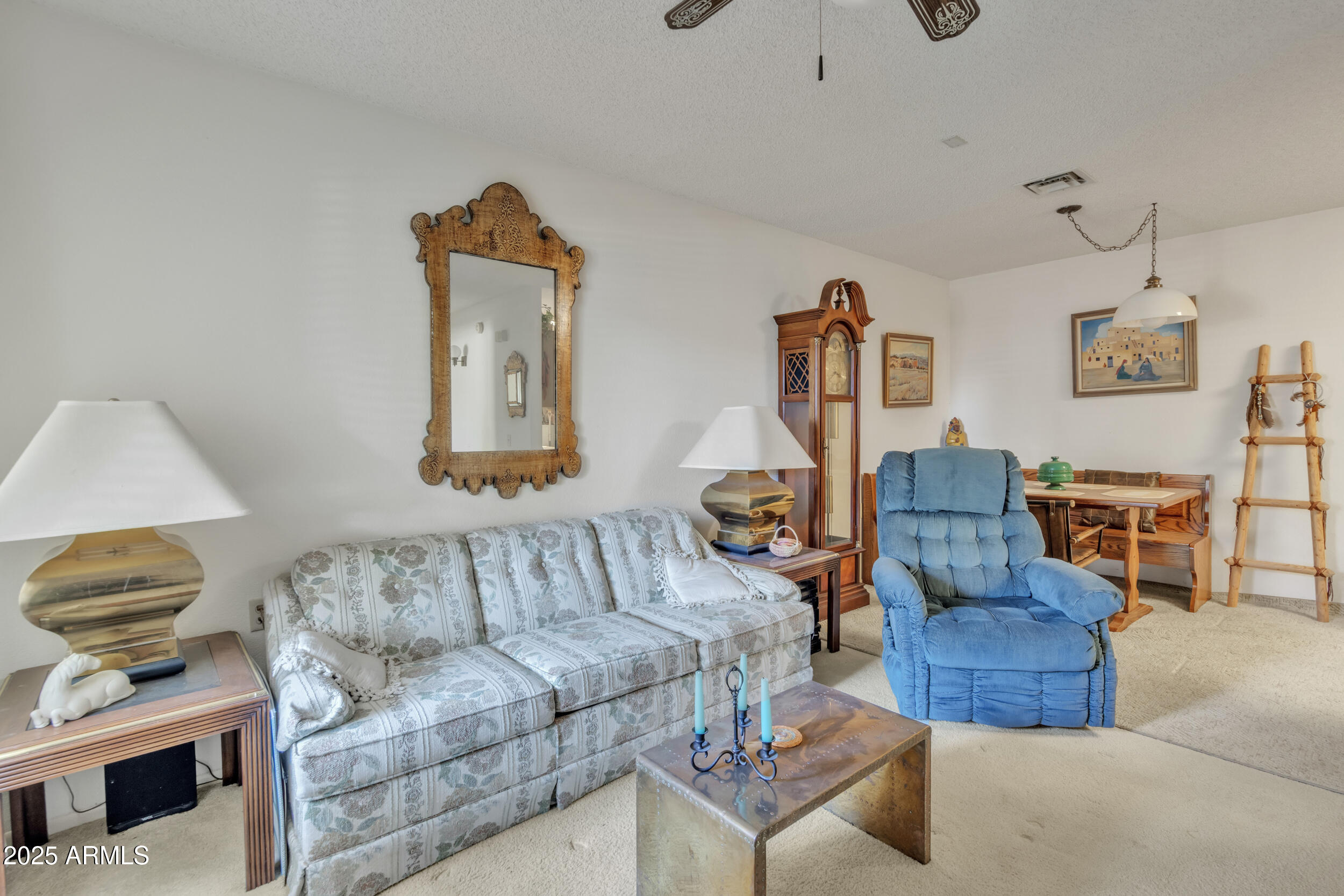 14300 West Bell Road, Unit 105 Surprise, AZ 85374 - Photo 4 of 45 a living room with furniture and a couch