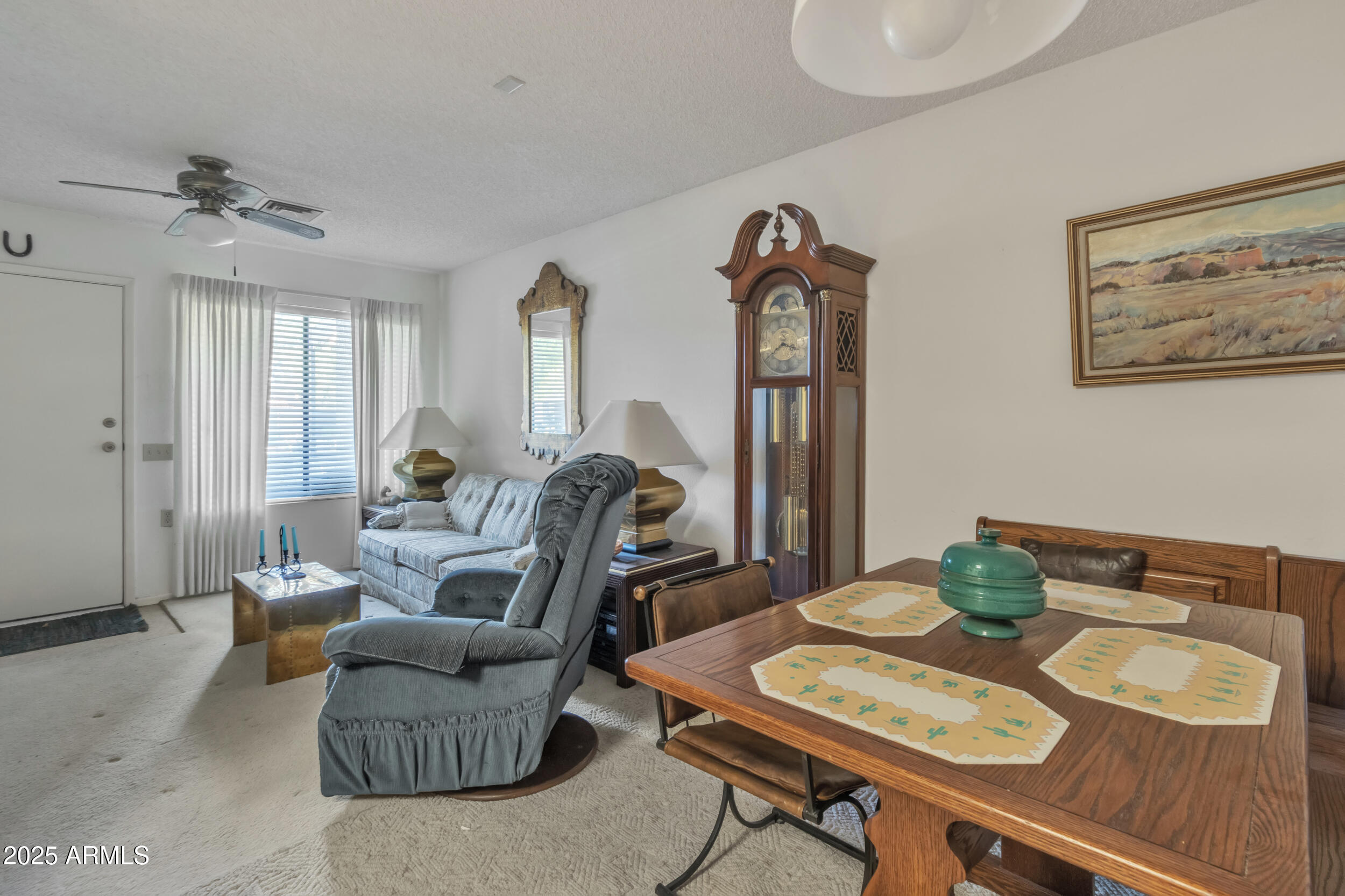 14300 West Bell Road, Unit 105 Surprise, AZ 85374 - Photo 7 of 45 a living room with furniture and a table