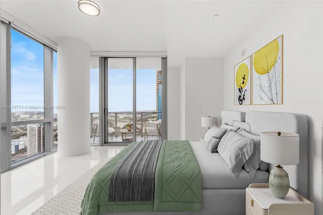 a bedroom with a large bed and a large window