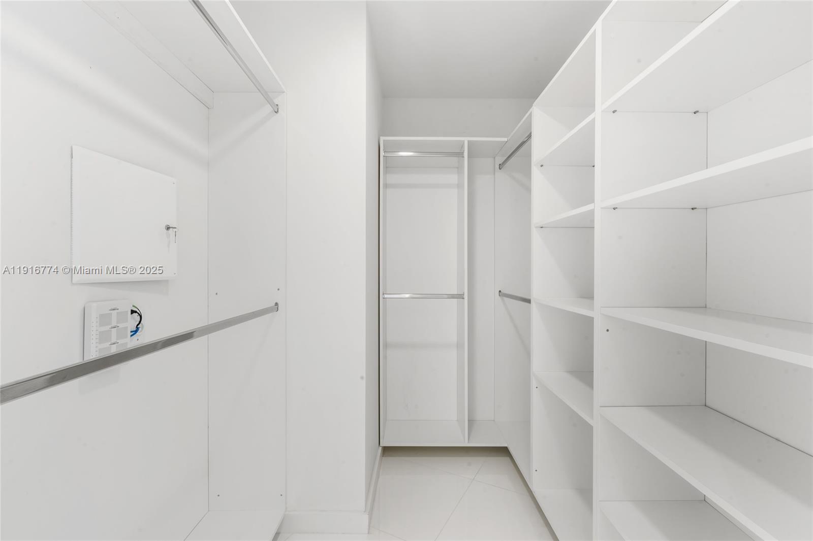 851 Northeast 1st Avenue, Unit 3202 Miami, FL 33132 - Photo 15 of 68 a view of an empty walk in closet