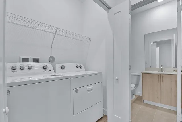 a utility room with dryer and washer