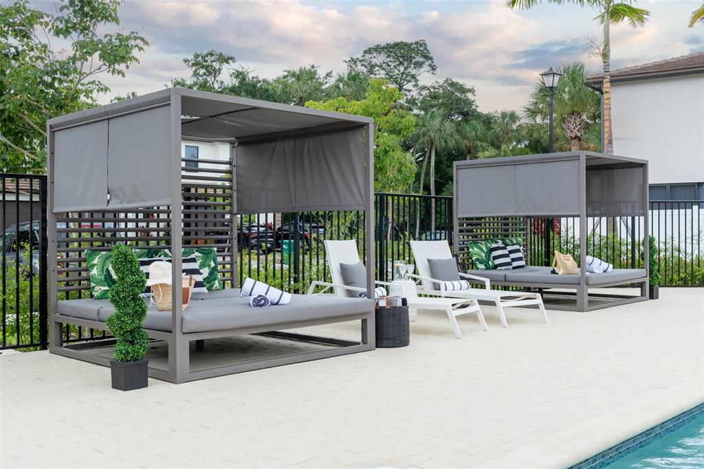 4083 Sunset Way Pompano Beach, FL 33069 - Photo 20 of 34 an outdoor space with patio furniture and potted plants