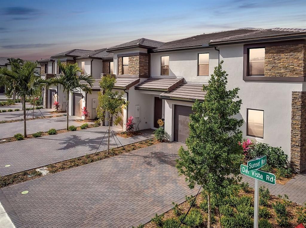 4083 Sunset Way Pompano Beach, FL 33069 - Photo 30 of 34 front view of a house with a small yard