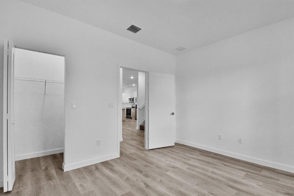 4083 Sunset Way Pompano Beach, FL 33069 - Photo 8 of 34 a view of an empty room and wooden floor