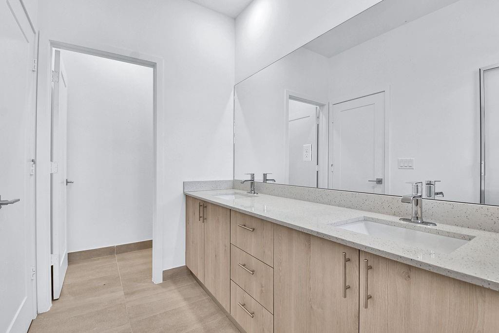 4083 Sunset Way Pompano Beach, FL 33069 - Photo 10 of 34 a bathroom with a sink and a mirror