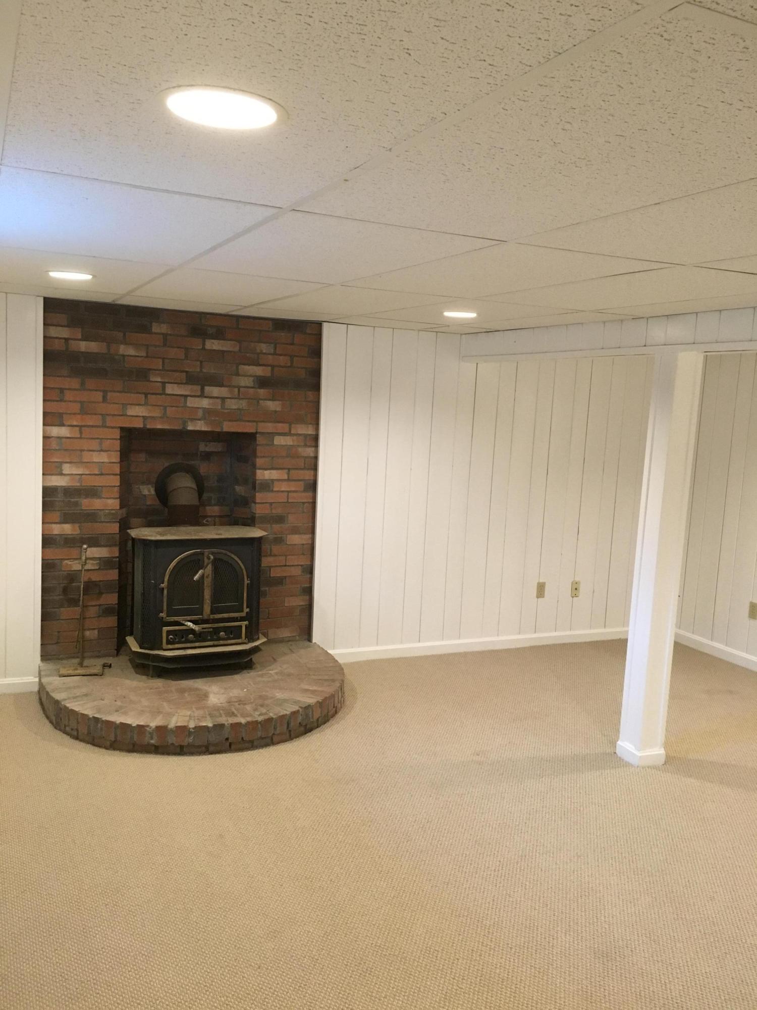 18 Seawood Road Wareham, MA 02571 - Photo 12 of 13 a kitchen with a fireplace