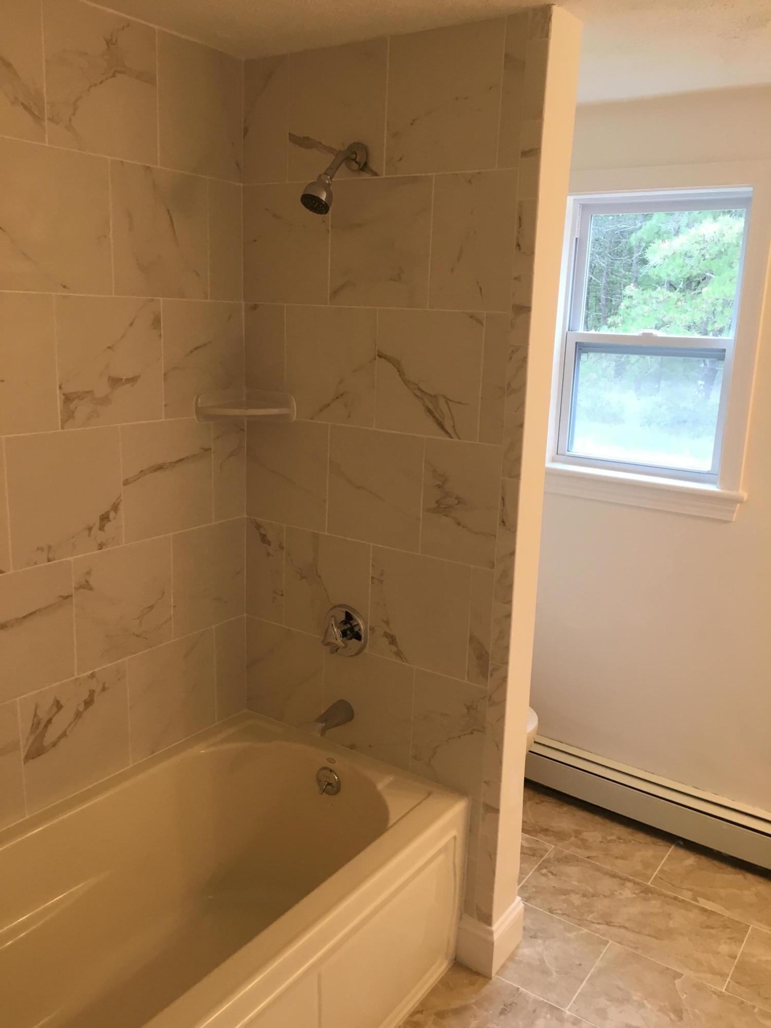 18 Seawood Road Wareham, MA 02571 - Photo 5 of 13 a bathroom with a bathtub