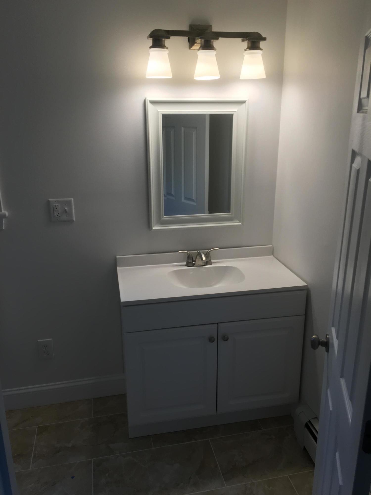 18 Seawood Road Wareham, MA 02571 - Photo 8 of 13 a bathroom with a sink vanity and mirror
