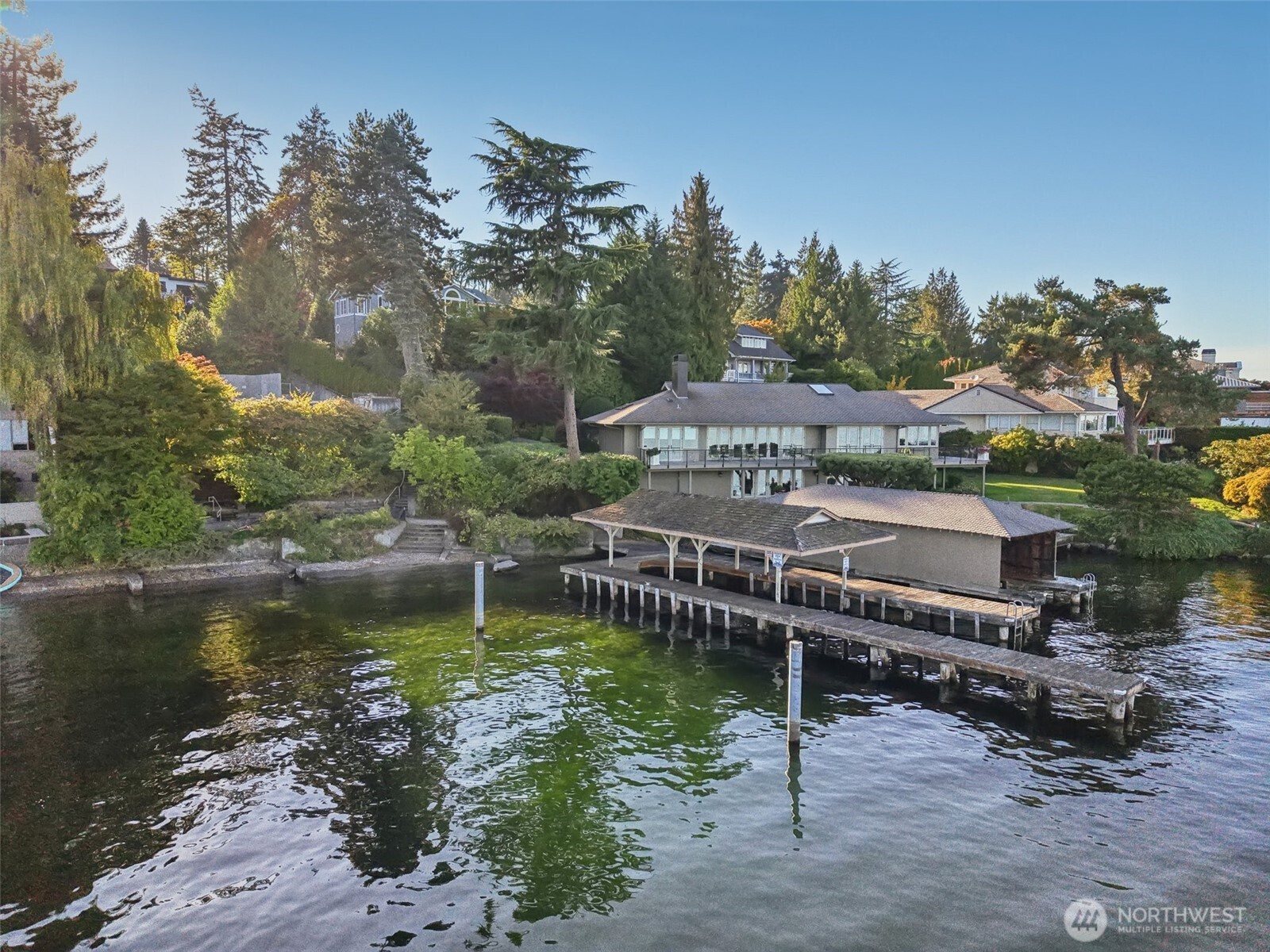 7220 North Mercer Way Mercer Island, WA 98040 - Photo 12 of 19 a view of a lake with a house in the background
