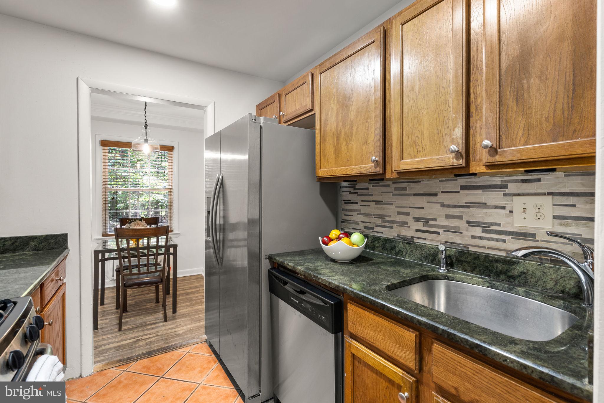 199 Talbott Street, Unit 199 Rockville, MD 20852 - Photo 15 of 31 a kitchen with a sink cabinets and stainless steel appliances