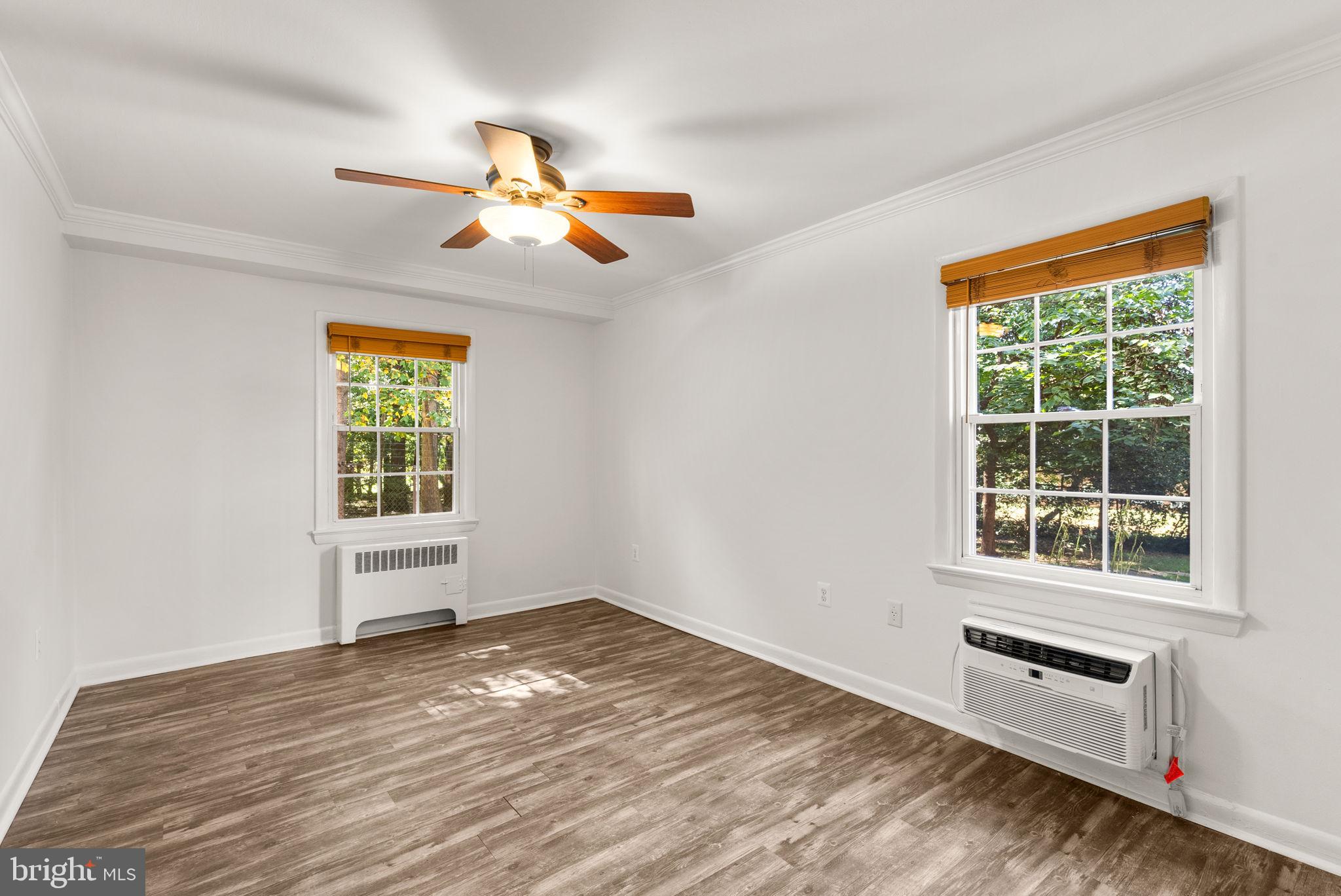 199 Talbott Street, Unit 199 Rockville, MD 20852 - Photo 16 of 31 a view of empty room with wooden floor and fan