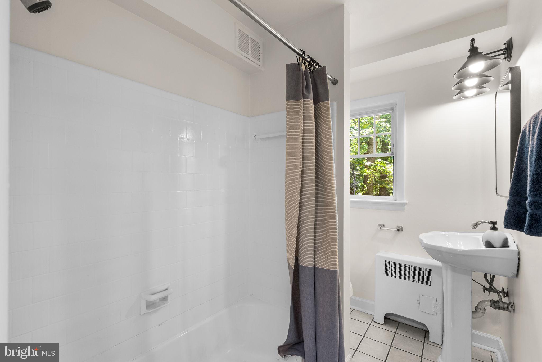 199 Talbott Street, Unit 199 Rockville, MD 20852 - Photo 26 of 31 a bathroom with a sink and a mirror