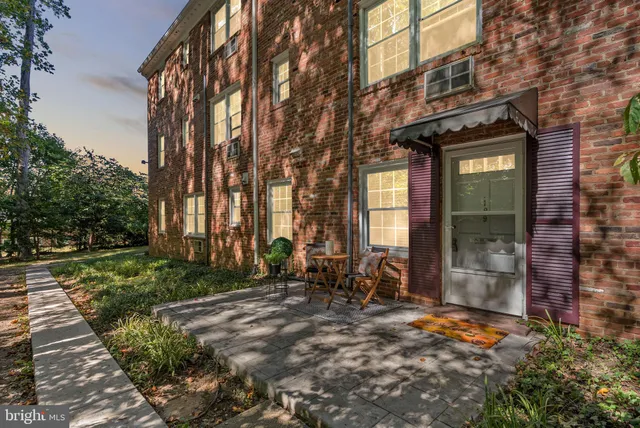 a view of a brick building with many windows