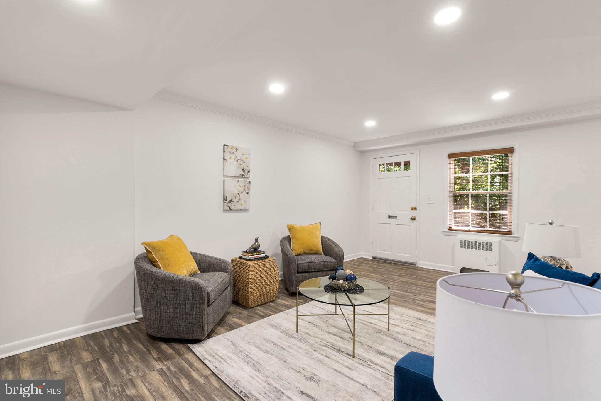 199 Talbott Street, Unit 199 Rockville, MD 20852 - Photo 6 of 31 a living room with furniture and a window