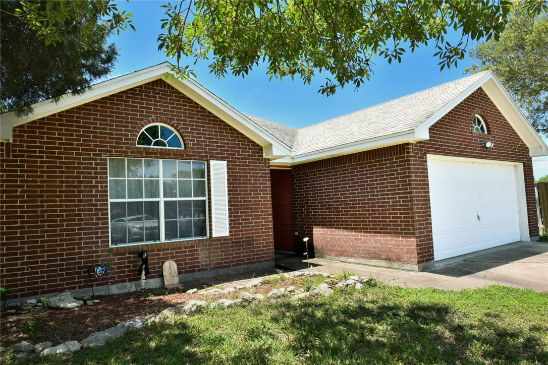 305 Hickory Bishop, TX 78343 - Photo 2 of 23 a front view of a house with a yard