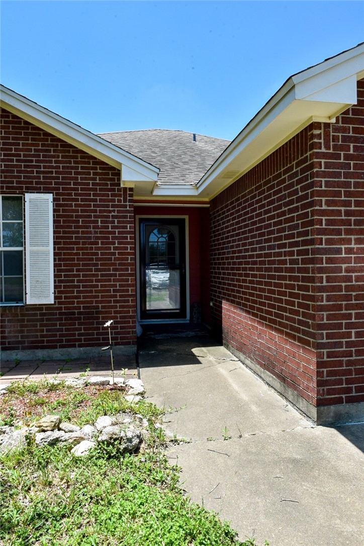 305 Hickory Bishop, TX 78343 - Photo 3 of 23 a front view of a house with a yard