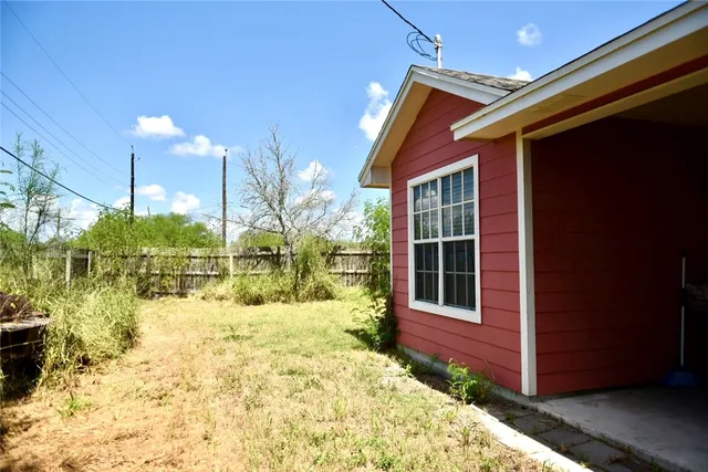 a view of a backyard of the house
