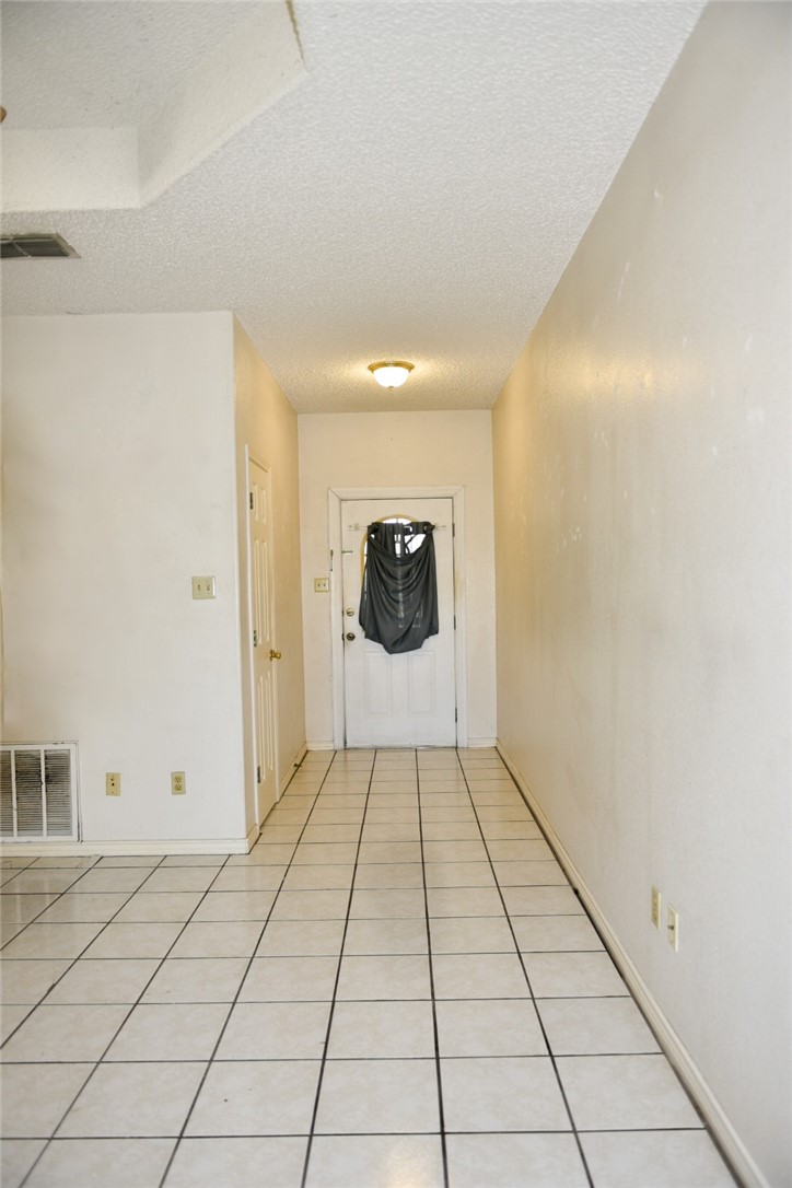 305 Hickory Bishop, TX 78343 - Photo 9 of 23 a view of an empty room and window